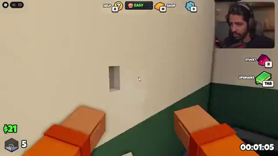 A punched hole in a Punch Out Of Prison cell wall with rubble on the floor